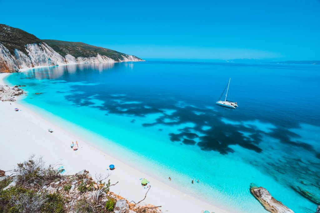 white sailing adventure catamaran yacht drift in clear blue