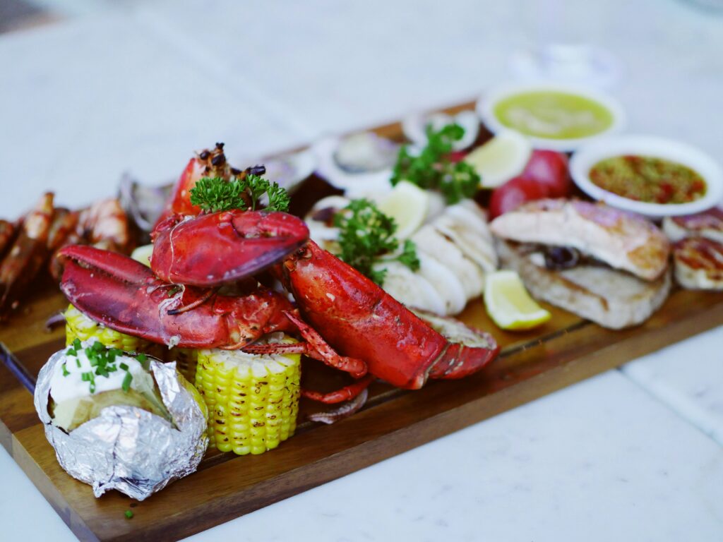 Nicely arranged gourme seafood platter on a wooden board