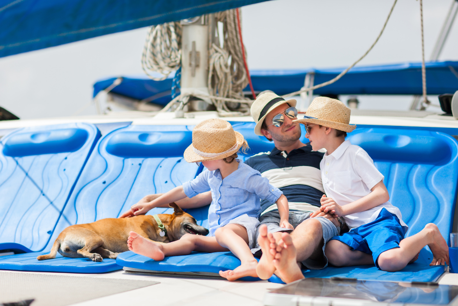 Father and sons on the deck of the catamaran