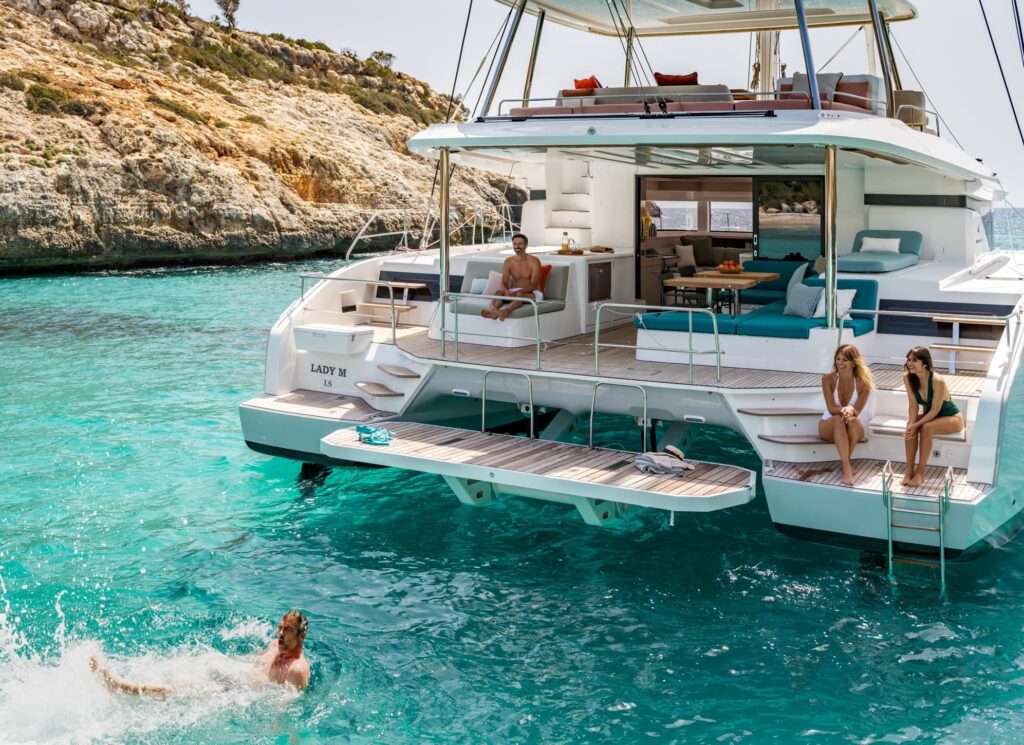 Choose perfect catamaran Mediterranean luxury - Lagoon 55 interior revealing premium salon layout, panoramic windows, and high-end finishes