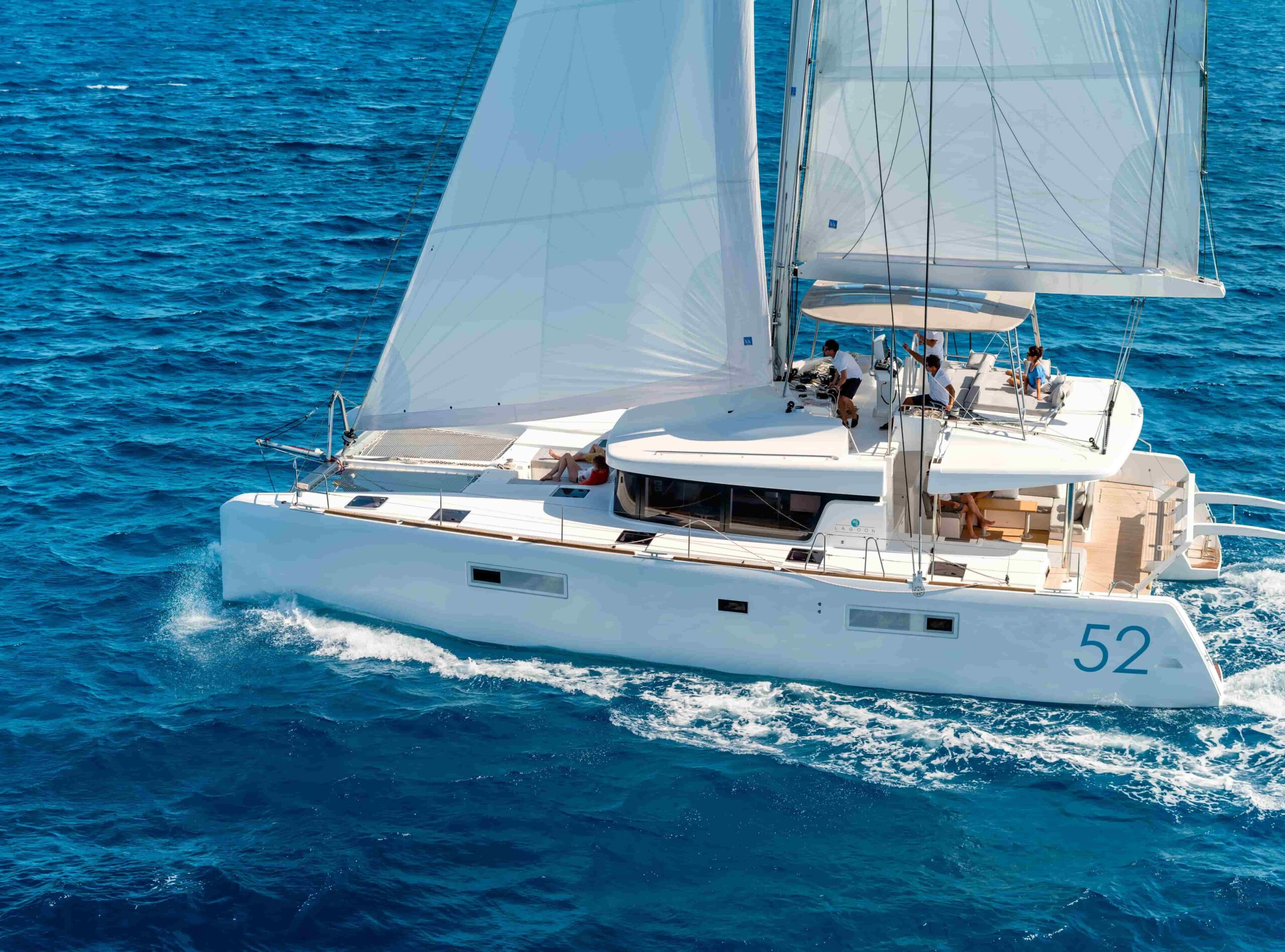 Luxury catamaran entertainment features - Lagoon 52 flybridge showcasing expansive social areas, premium outdoor dining setup, and sunset lounge spaces perfect for Mediterranean celebrations